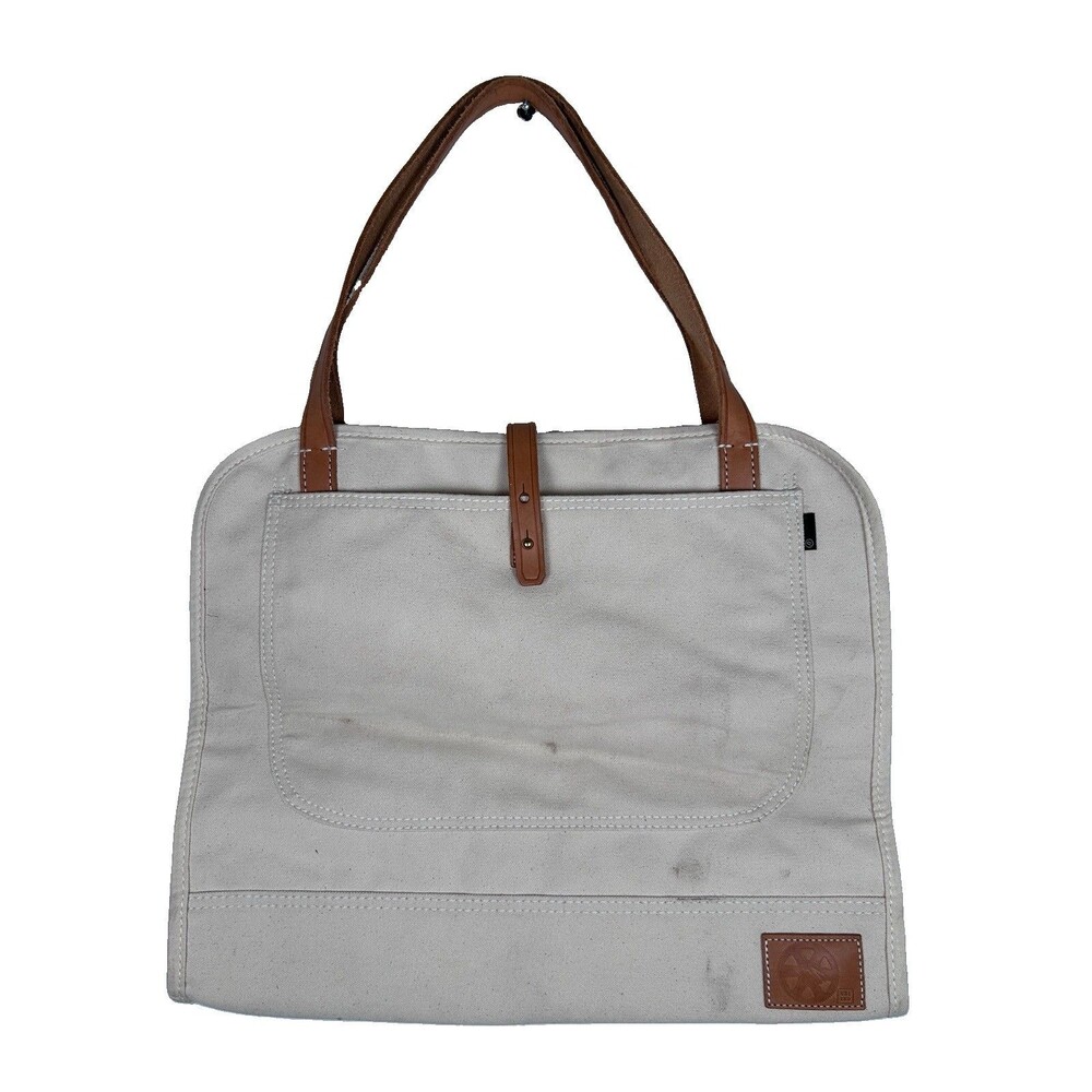 The Denim Log Bag Mi Cocina Ubi-Ind Canvas Log sling leather straps & brass
